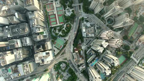 central hong kong, top down aerial view of traffic and city skyscrapers