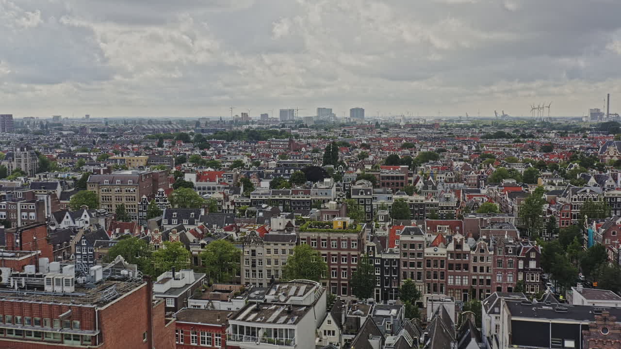 Amsterdam Netherlands Aerial v23 drone low level flyover the neighborhoods of grachtengordel-west and jordaan with rows of gabled townhouses, cinematic fly towards the skyline - August 2021