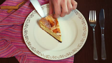 chef putting cake slice on plate. piece of apple pie on dish. sliced apple pie