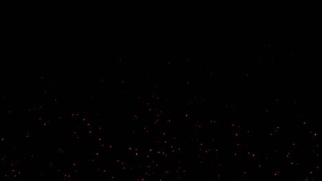 hermosas chispas ardientes horizontales que se elevan de un pequeño fuego rojo en la noche oscura. abstracto alfa aislado fuego partículas brillantes en fondo negro. movimiento lento. animación en bucle. lado móvil.4k