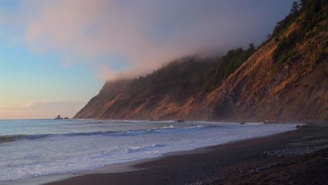 usal beach campground sunset black sand waves lost coast trail california sunset afternoon mist fog on bluffs rugged coastline remote untouched sinkhole wilderness pacific ocean surf waves static
