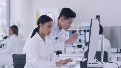 two scientist using a computer