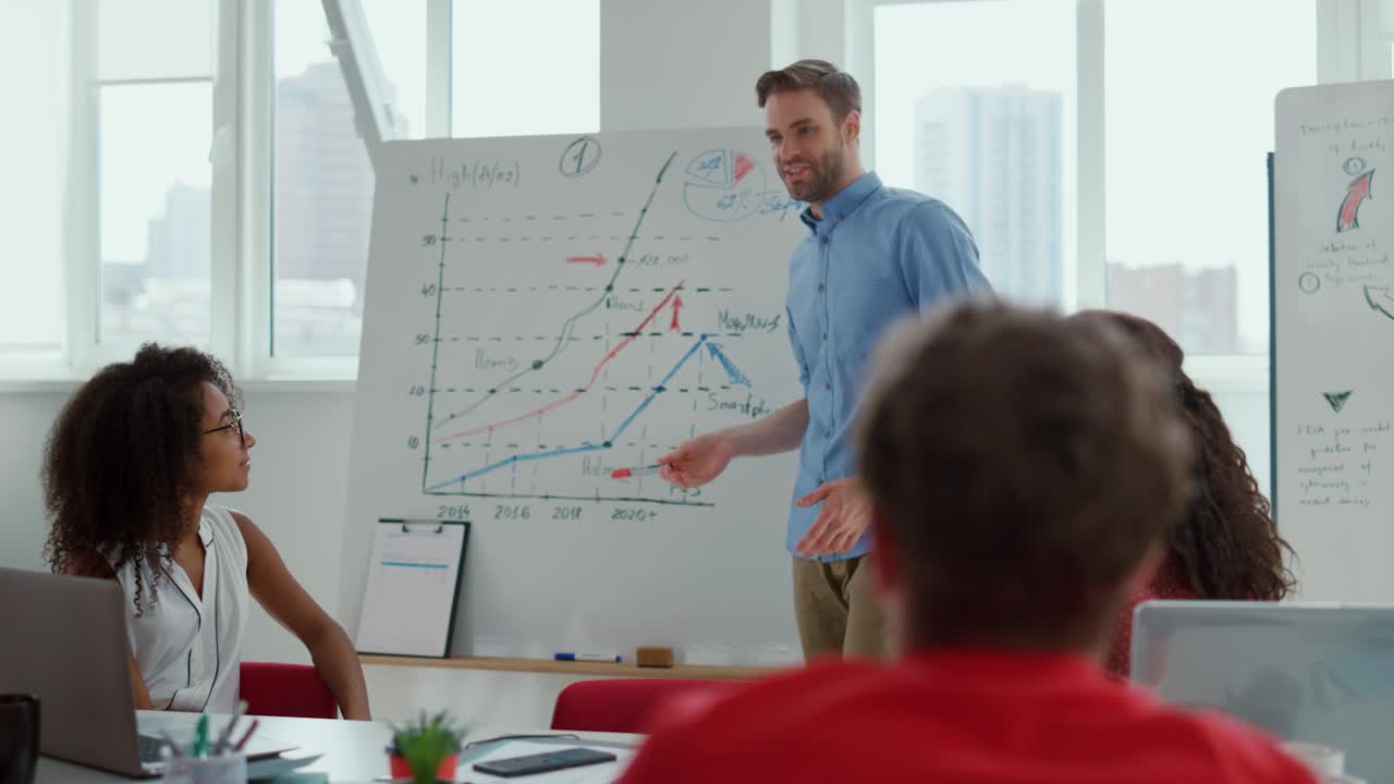 Happy people clapping to speaker in meeting room