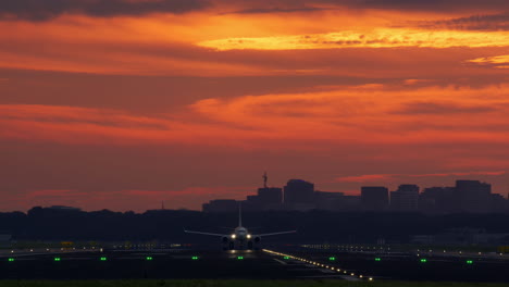 airplane landing at sunset