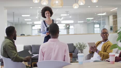 Diverse-group-of-male-and-female-business-colleagues-working-in-office