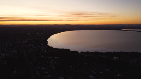 drone aerial pan landscape shot of tuggerah lakes long jetty afternoon sunset and suburbs central coast nsw australia 3840x2160 4k