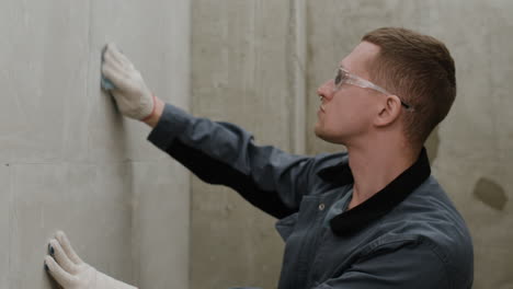 construction worker repairing a wall