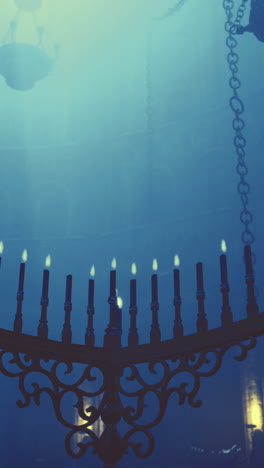 mysterious lighting in an ancient hall with a grand menorah overhead