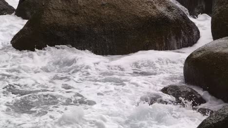 ocean waves crashing against coastal rocks