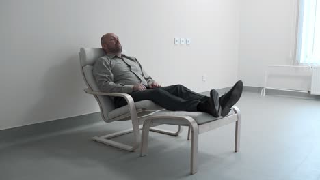 man relaxing in a chair