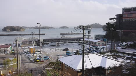 matsushima bay in miyagi prefecture, snow falling over rural japan in winter