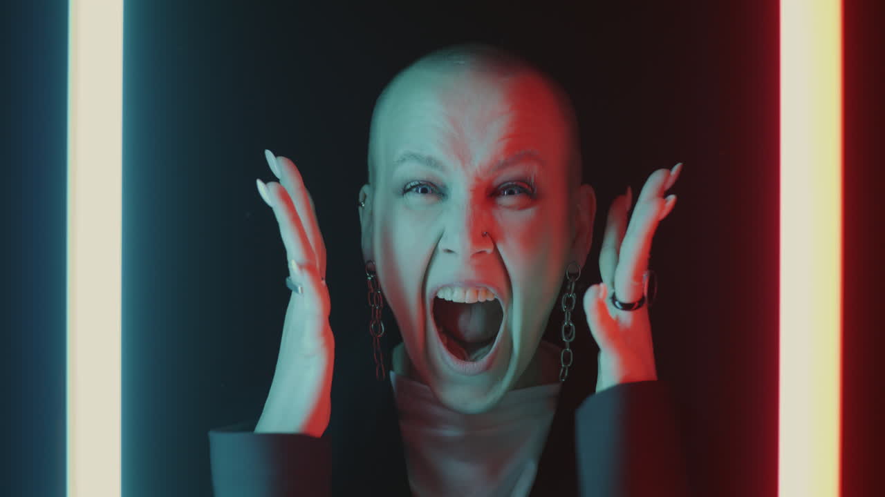 Woman expressing emotion in neon lighting