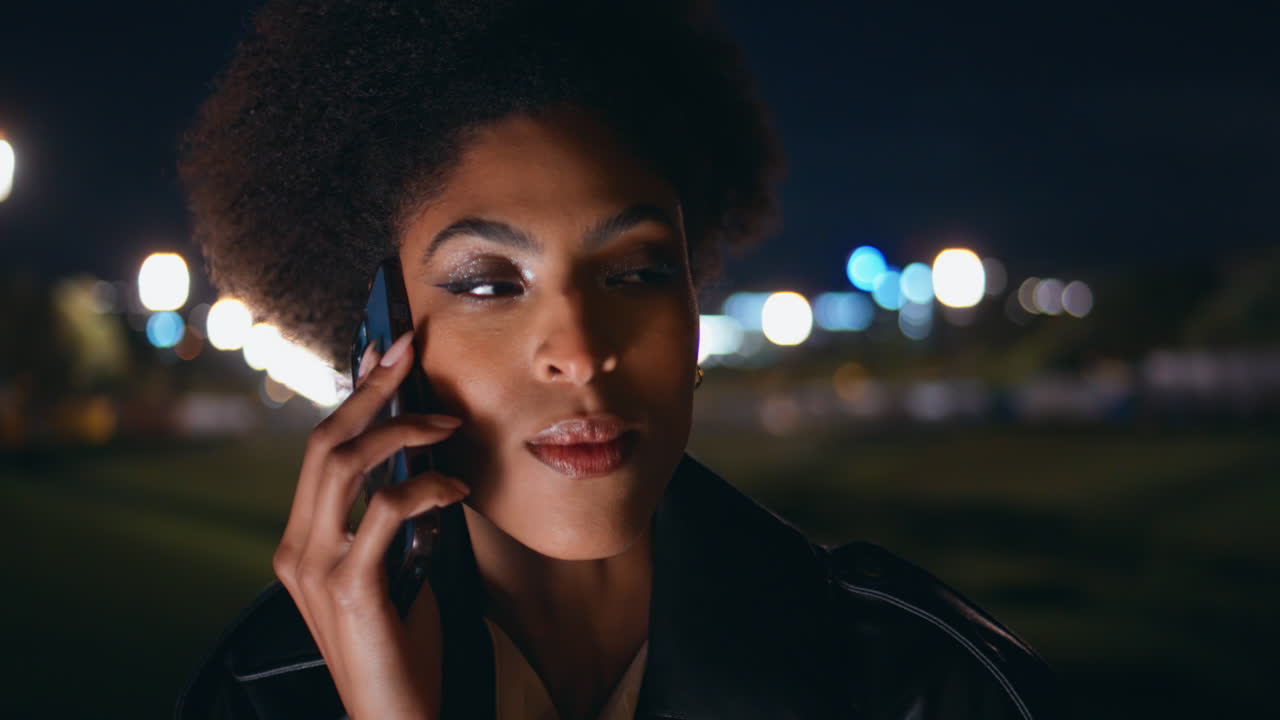 Closeup girl talking cellphone drinking champagne at night town party portrait