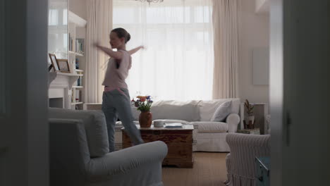 beautiful-teenage-girl-dancing-at-home-practicing-ballet-dance-moves-having-fun-rehearsing-in-living-room