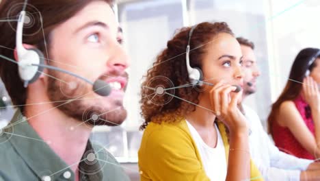 animation of networks of connections over business people wearing phone headsets