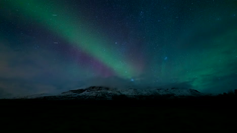 stunning aurora borealis display over snowy mountain