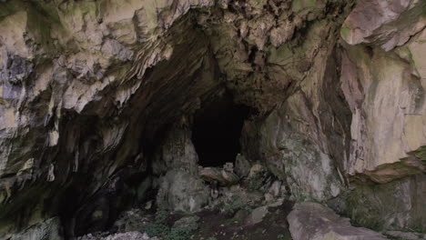 entering a small natural cave