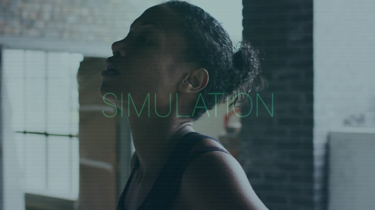 Wearing workout gear, woman in industrial setting with animation text overlay