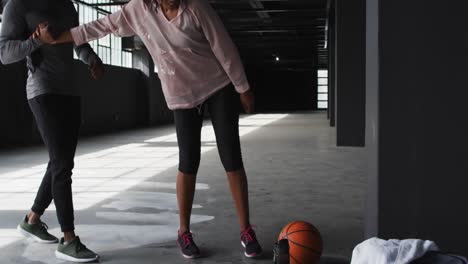 African-american-man-woman-to-get-up-and-grabbing-a-basketball