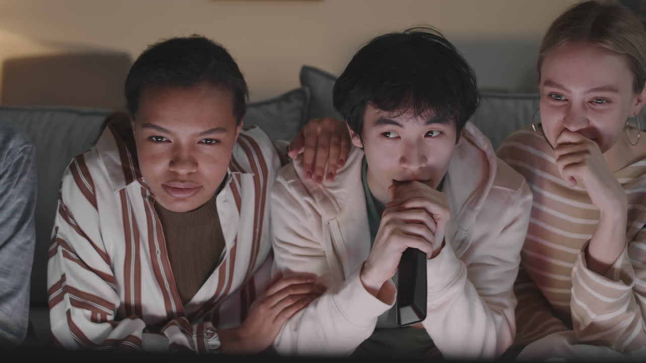 Diverse Friends Watching Movie at Home