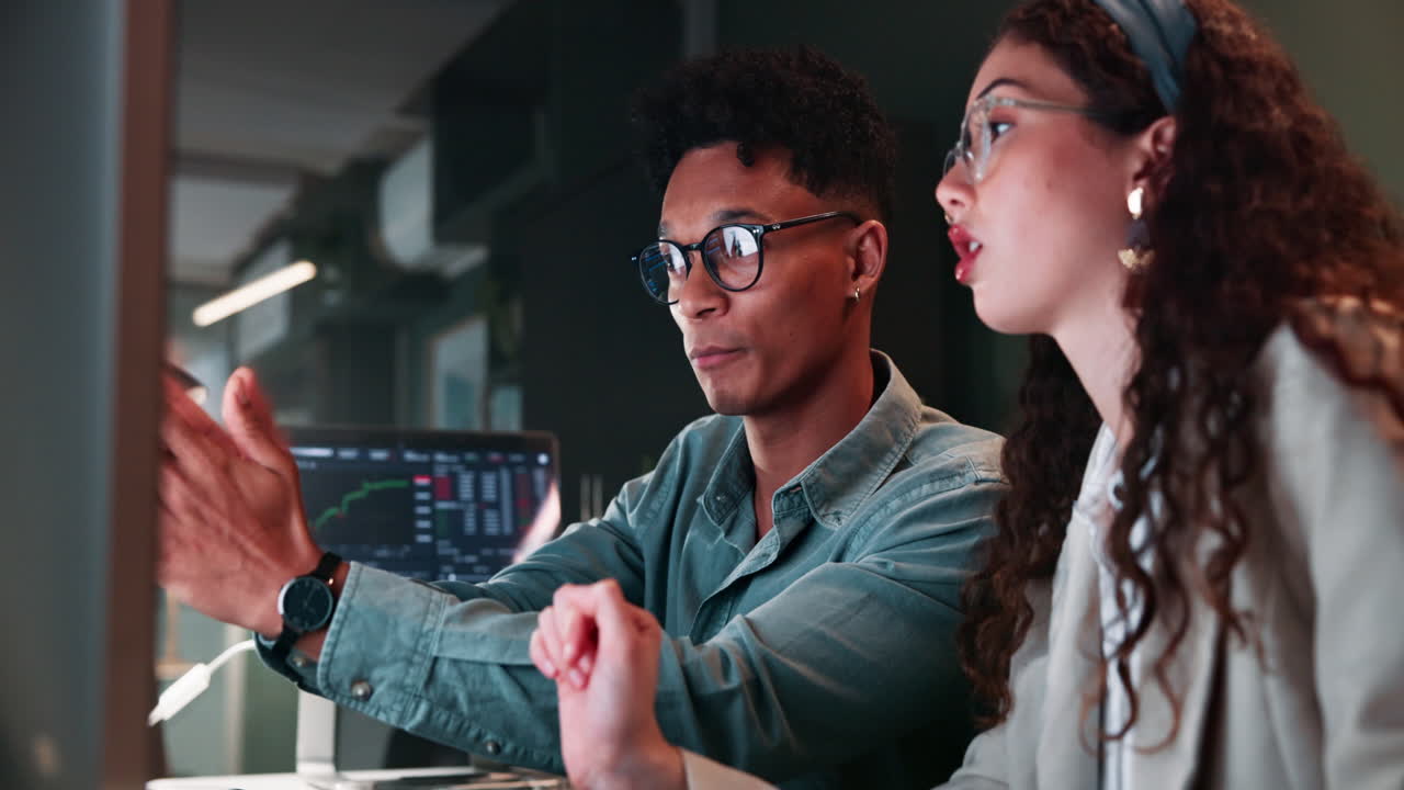 Business Colleagues Analyzing Data at Night