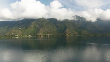 panoramic aerial overview of serene lake atitlan guatemala and tropical mountain valleys