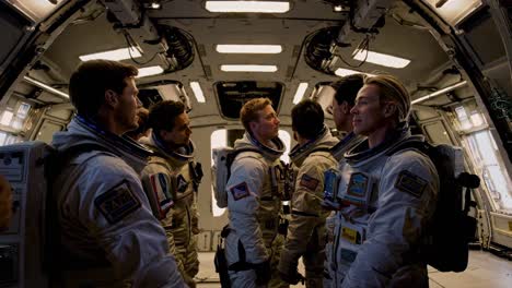 astronauts in spacecraft interior