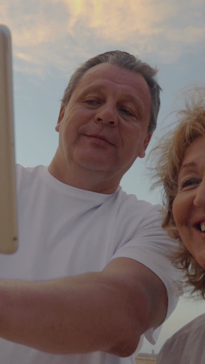 Older couple taking a selfie