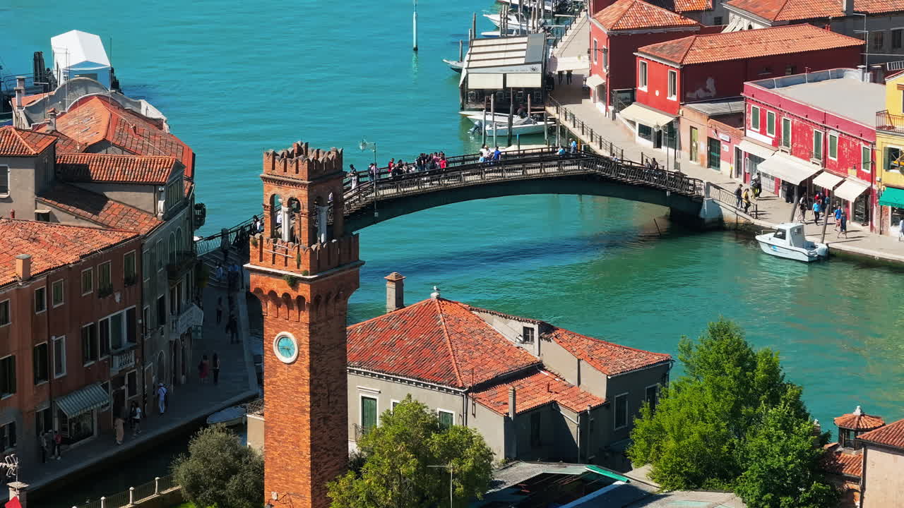 Aerial drone view of the Campanile Santo Stefano Clock Tower in Murano Island, Venice, Italy