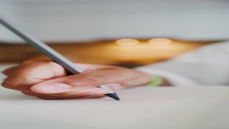 person writing with pencil