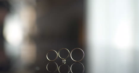 close up of wedding rings on table 1