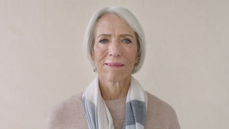 portrait of retired elderly woman smiling wearing scarf