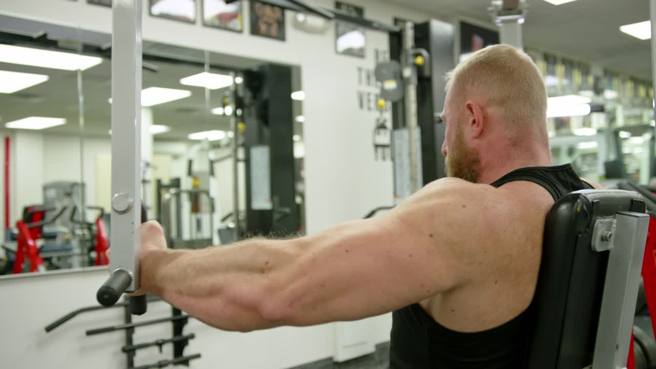 Strong bodybuilder strength workout in sport club