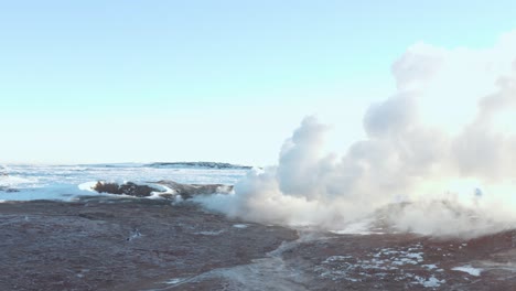 Impressive-steam-clouds-rise-from-volcanic-crater-with-bright-sunlight