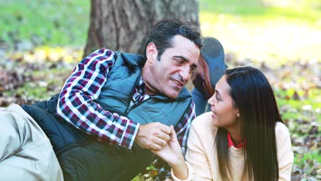 couple romancing under the tree