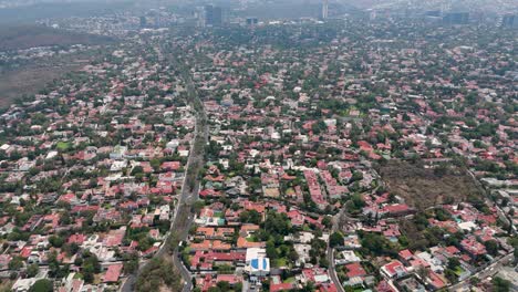 drone aerials of the western area of mexico city on a sunny day