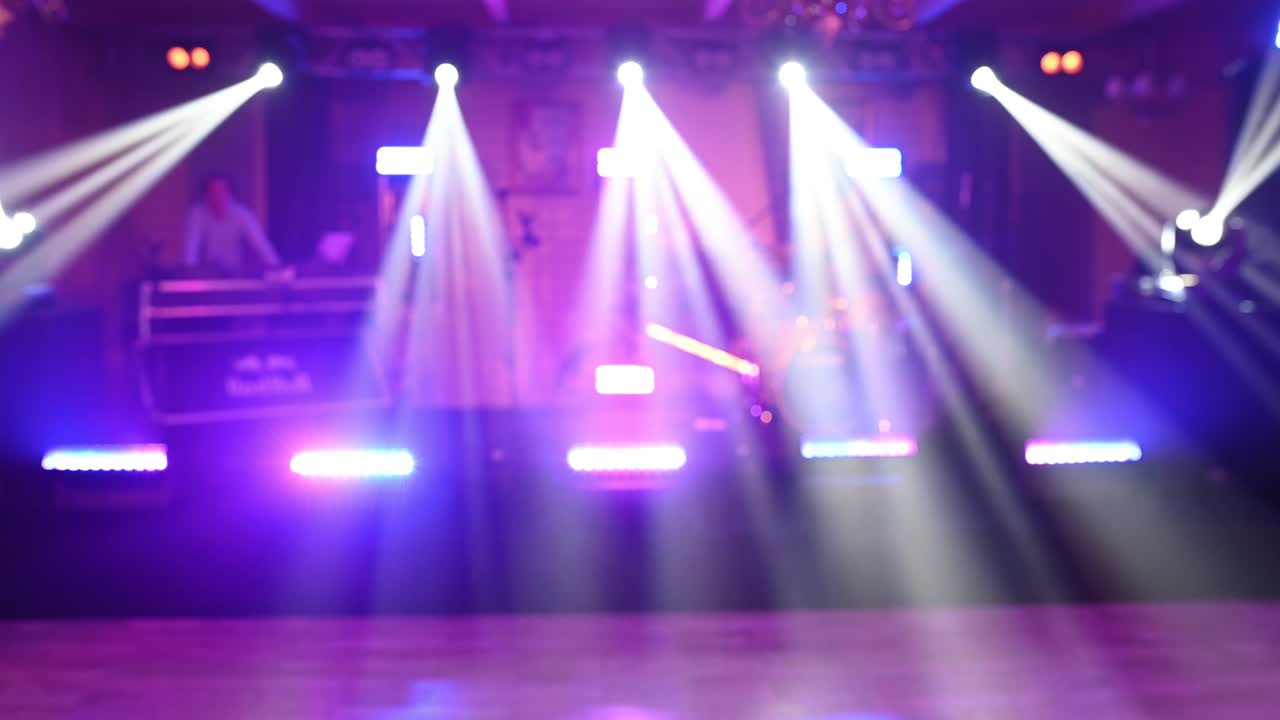 An empty stage for a performance while waiting for the singers. Bright LED lighting and spotlights