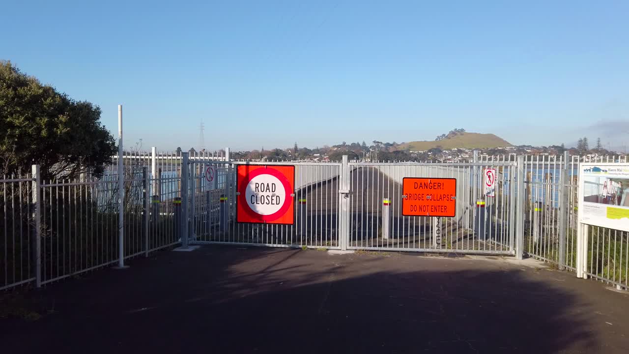 Road closed and bridge collapse signs