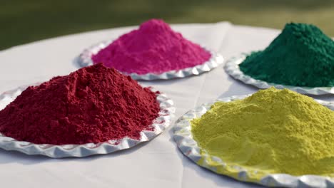 different holi colors decorated in a plate for festival