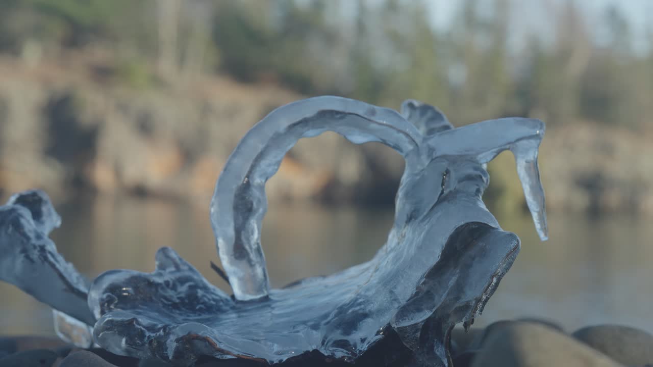 Macro Close Up of Unique Natural Ice Formation Frozen on Shoreline Rock