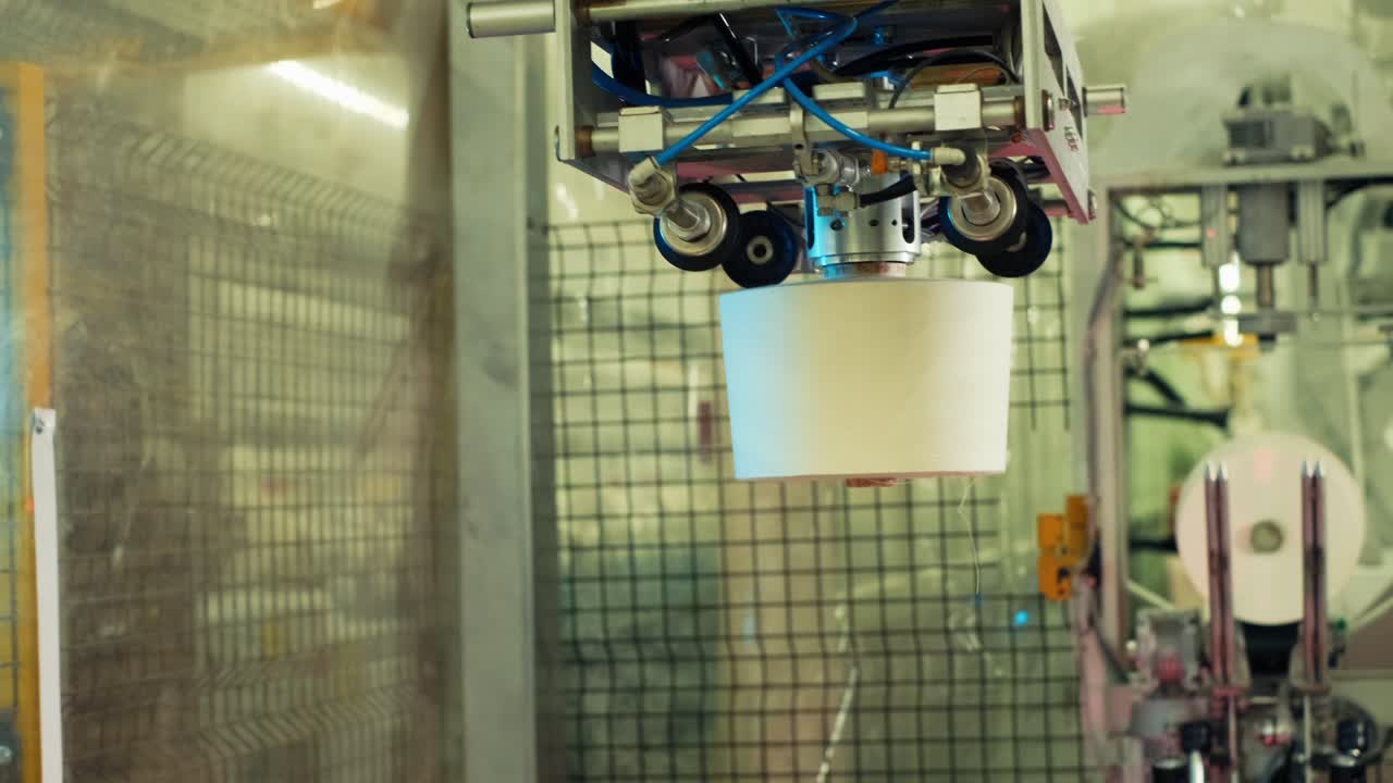 Yarn creel spools getting packed in an automatic machine in textile factory-1