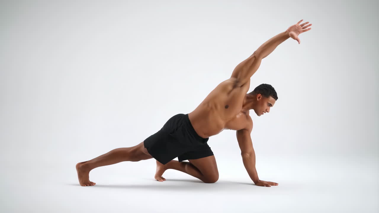 Athletic man performing a stretching or yoga pose