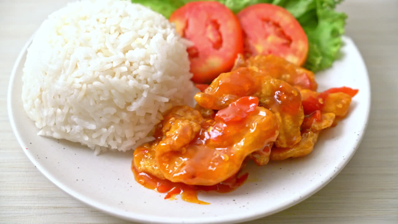 Fried fish topped by three flavors chili sauce with rice