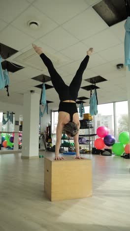 woman performing advanced yoga stretch in a vibrant gym woman performing advanced yoga stretch in a vibrant gym