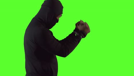 Criminal-in-handcuffs-and-mask-is-angry-that-he-was-arrested---easily-keyable,-clean-green-screen