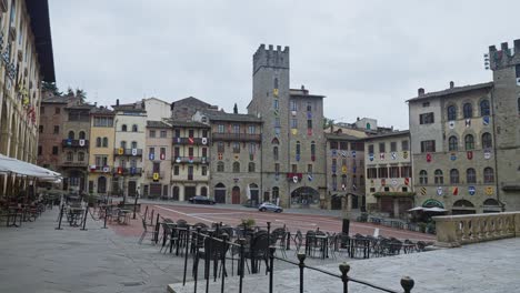 extensive shot of typical and landmark buildings at arezzo square in tuscany, italy