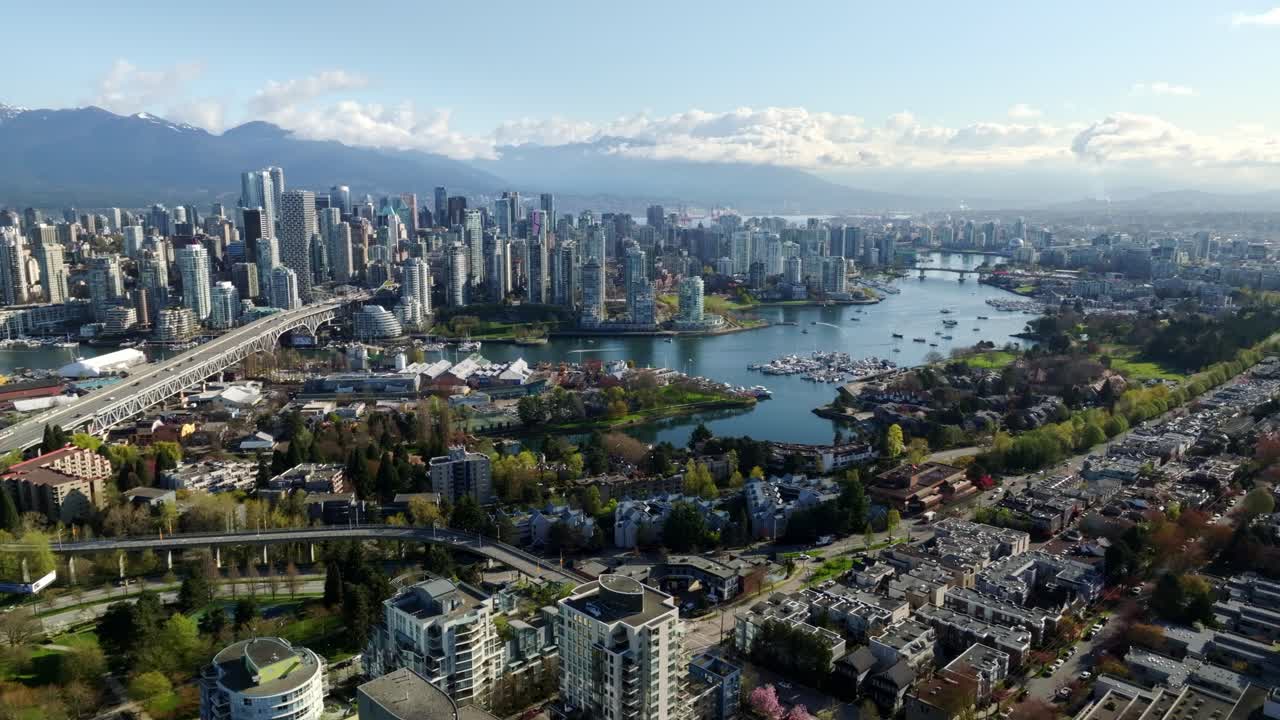An Elevated Cityscape With Bridges, Boats, and High-rises as Seen From South Granville in Downtown Vancouver, Canada - Wide Shot