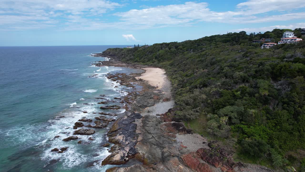 Waves Crashing Against The Rocky Shore Of First Bay Coolum Beach And Third Bay In QLD, Australia. - aerial shot