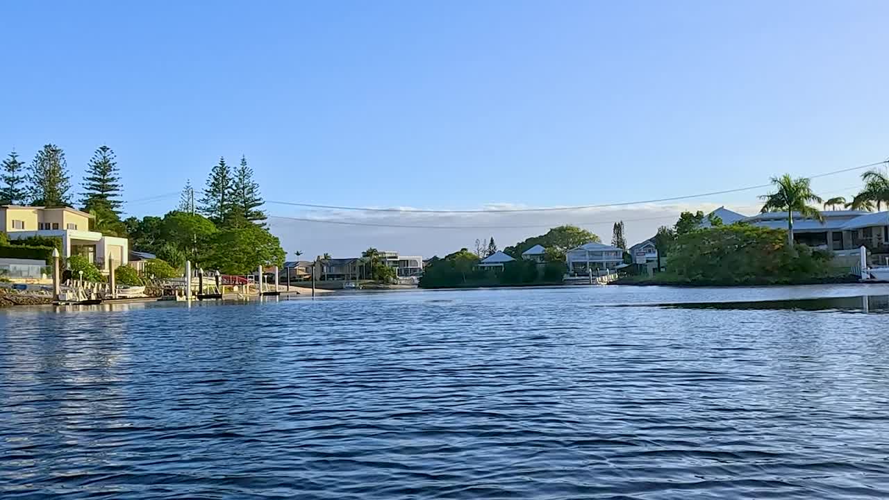 Explore the calm waters and picturesque waterfront homes nestled along a peaceful river setting.