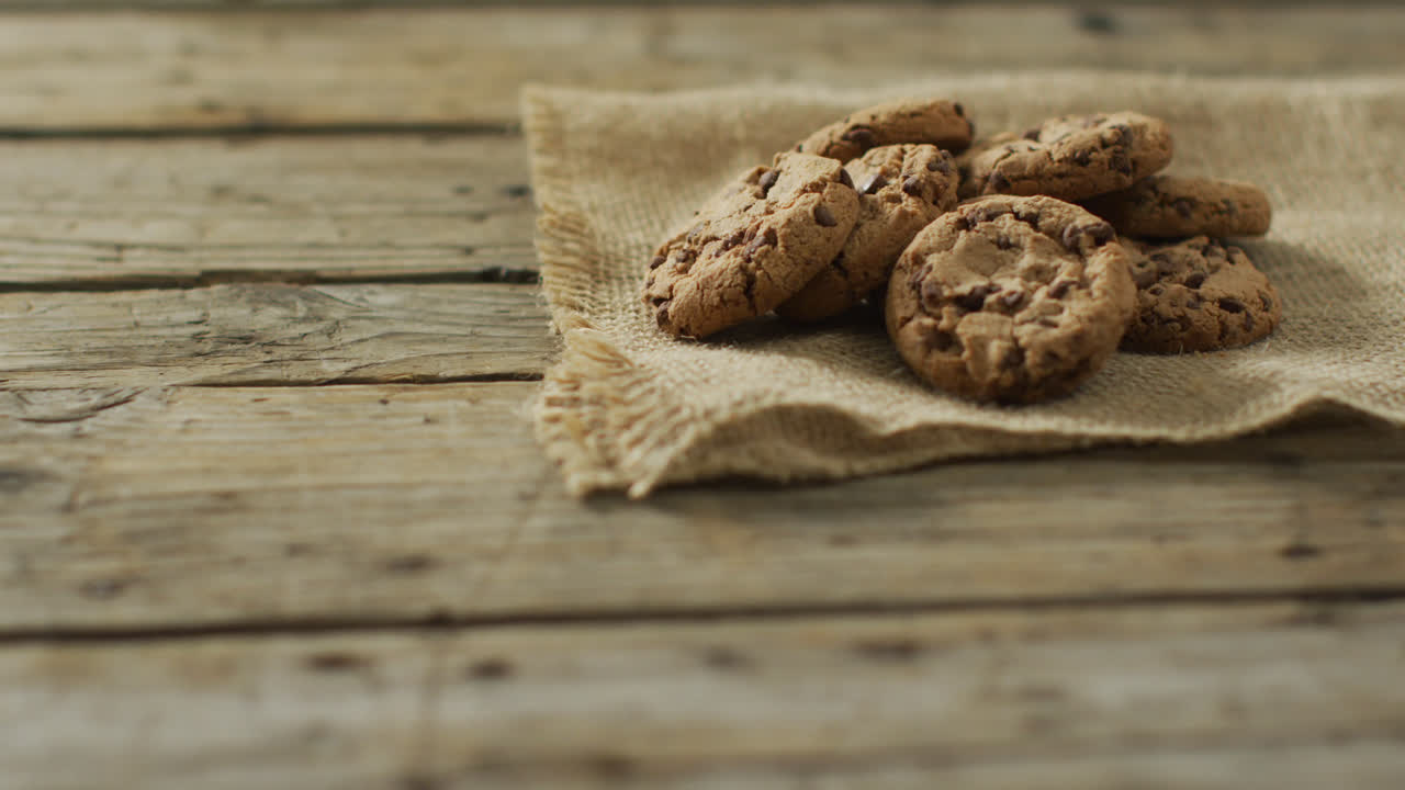 Video of biscuits with chocolate on wooden background